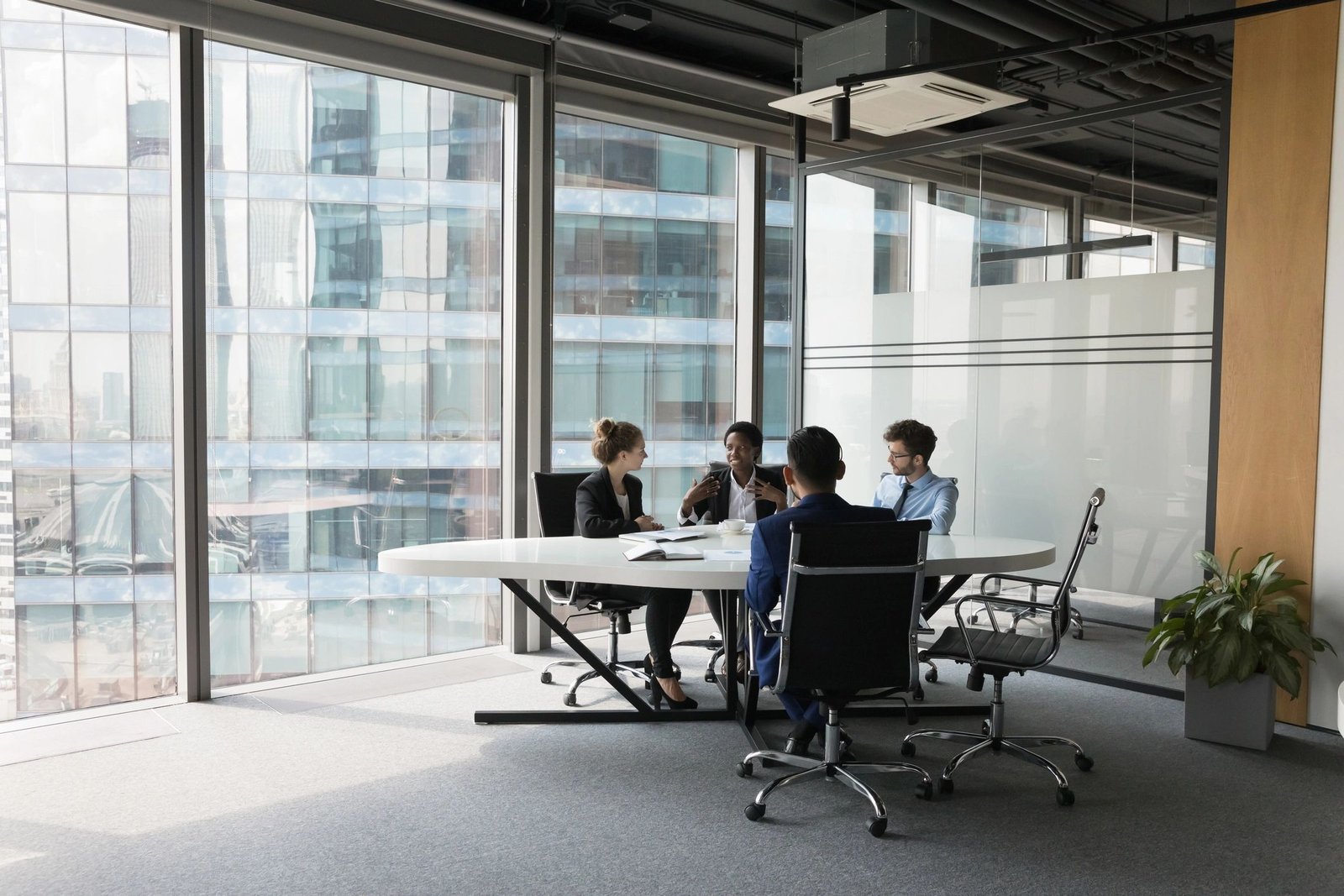 Diverse business team talking in a meeting room