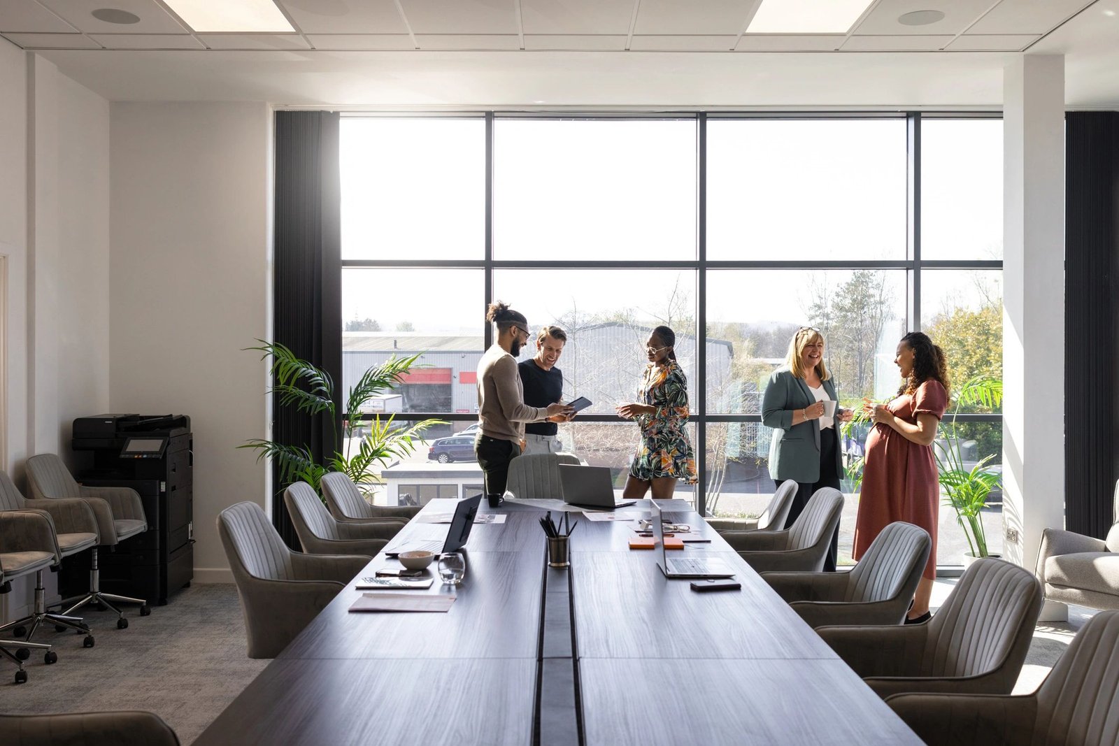 Consulting team discussing strategy in a modern conference room