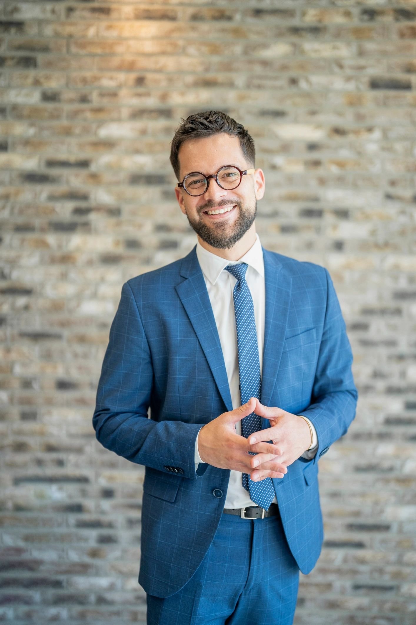 Portrait of Cameron Reed, client success lead